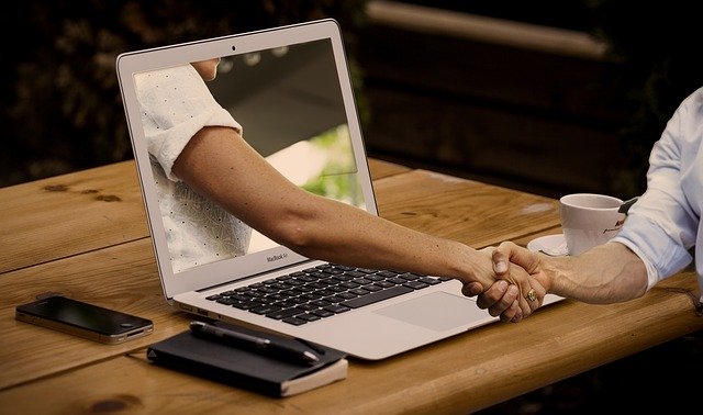 hand shake through a computer